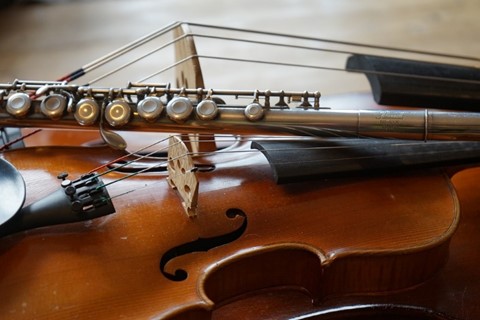 Photo of a flute, violin and cello